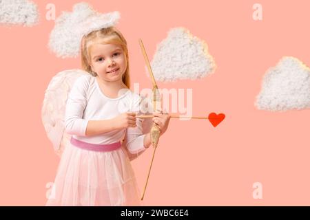 Cute little girl dressed as cupid with bow, arrow and clouds on pink background. Valentine's Day celebration Stock Photo