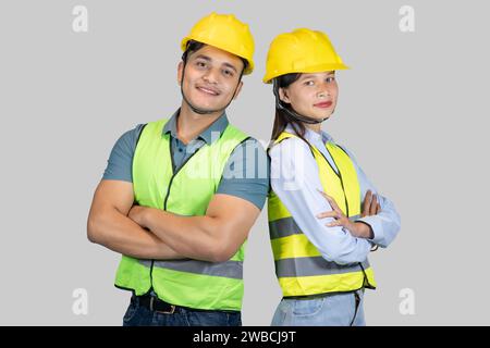 Asian Couple Engineer and Architect giving gestures and expressions on construction field Stock Photo