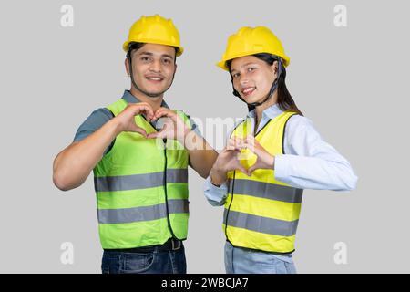 Asian Couple Engineer and Architect giving gestures and expressions on construction field Stock Photo