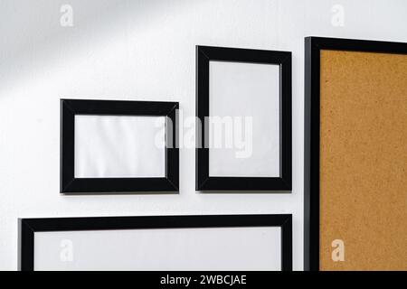 Set of black frames on white wall with copy space Stock Photo