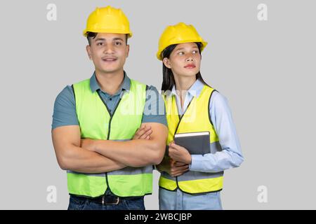 Asian Couple Engineer and Architect giving gestures and expressions on construction field Stock Photo