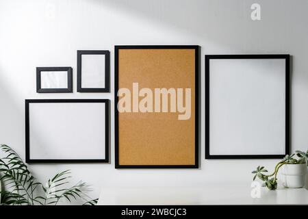 Set of black frames on white wall with copy space Stock Photo