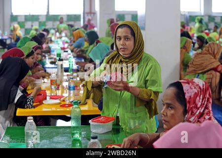 Dhaka, Bangladesh. 18th Dec, 2023. Ready-made garments worker having food in a garments factory in Dhaka, Bangladesh on January 10, 2024. Photo by Habibur Rahman/ABACAPPRESS.COM Credit: Abaca Press/Alamy Live News Stock Photo