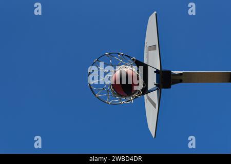 The basketball in the basket. Shoot succeeds Stock Photo