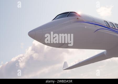 Crisp, up-close imagery of a luxurious private jet's frontal profile, emphasizing the cockpit against an expansive clear blue sky, symbolizing opulenc Stock Photo