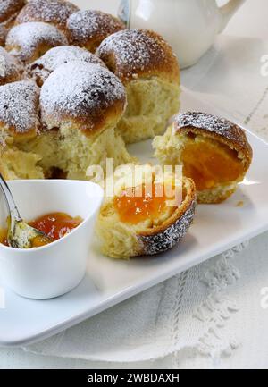 Homemade Austrian Buchteln filled with apricot jam. Sweet buns. Yeast dough cakes. Overhead view. Stock Photo