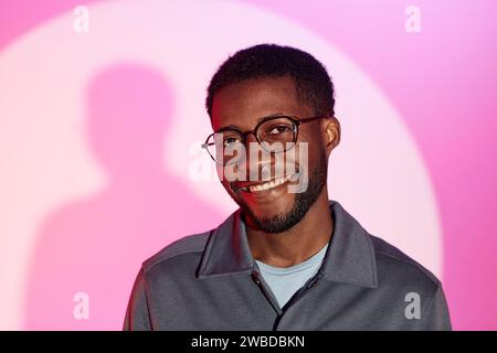 Portrait of Handsome Young Man with Toothy Smile Stock Photo