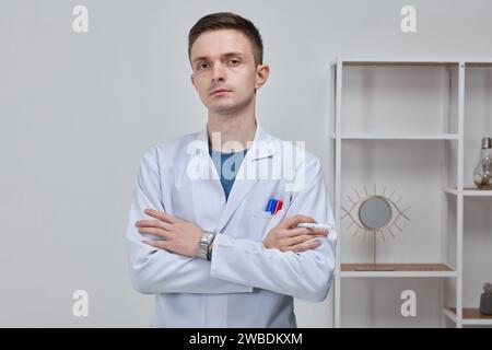 portrait of a young male doctor in the office Stock Photo