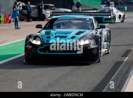 Claude Bovet and David McDonald's, White, Black and Grey, 2017, Aston Martin GT3, exiting the pit lane at the start of Masters Legends Endurance Race Stock Photo