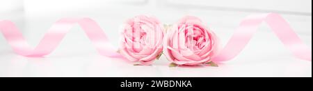 Two heart shaped red roses and ribbons isolated on white background, Valentines day Stock Photo