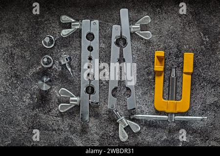 Flaring Clamp Set For Copper Pipes On Dark Background Stock Photo