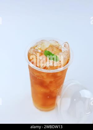 Ice Tea on Plastic Cup with Mint Leaf, Isolated on White Stock Photo