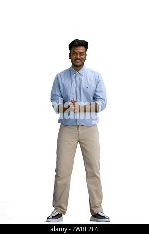 A man in a blue shirt, on a white background, in full height, folded his arms Stock Photo