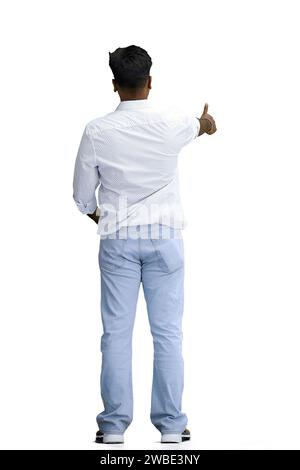 A man in a white shirt, on a white background, in full height, shows a thumbs up, back view Stock Photo