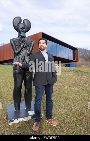 Glauburg, Germany. 10th Jan, 2024. Marcus Coesfeld has been the new director of Keltenwelt am Glauberg, Archäologisches Landesmuseum Hessen, since January 1, 2024. He stands next to a replica of the statue of the 'Celtic Prince of Glauberg' on display in the museum. The ceremonial handover of office will take place on 11.01.2024. Credit: Christian Lademann/dpa/Alamy Live News Stock Photo