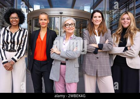 Team of multiracial and diverse businesswomen led with the boss posing for the camera.  Stock Photo