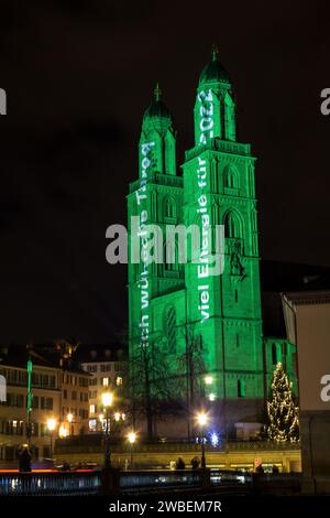 Zurich, Switzerland - 02. January 2022: The new year light show in down town Zurich with German text: 'much energy for 2022' projected on the church G Stock Photo