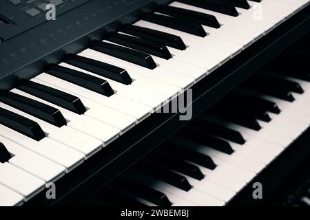 Digital piano keyboards close up, toned in black and white Stock Photo