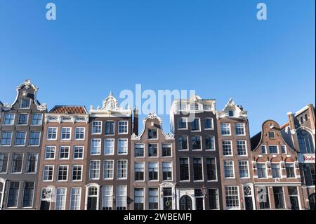 Amsterdam The Netherlands 10th January 2024 Section of Keizersgracht with an absence of trees allowing an unhindered view of the canal houses and their varying gables. grachten, grachtenpanden, gevels, Stock Photo