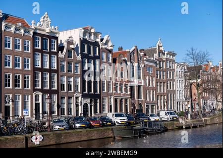 Amsterdam The Netherlands 10th January 2024 Section of Keizersgracht with an absence of trees allowing an unhindered view of the canal houses and their varying gables. grachten, grachtenpanden, gevels, Stock Photo