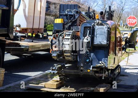 Using drilling machine is used to lay underground optical fiber buried cables in order to provide faster internet service Stock Photo