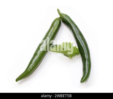 Letter A made from green salad and chili peppers alphabetic ABC capital letters made of chillies, peppers, for text, encyclopedia, cook book, cookery Stock Photo