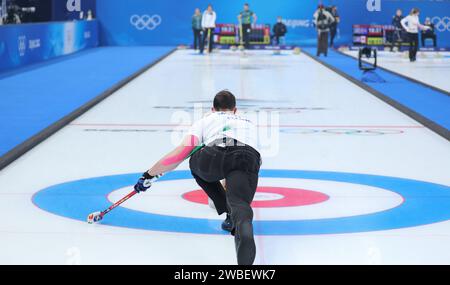 FEB 5, 2022 - Beijing, China: Stefania Constantini and Amos Mosaner of Team Italy against Rachel Homan and John Morris of Team Canada in the Round Rob Stock Photo