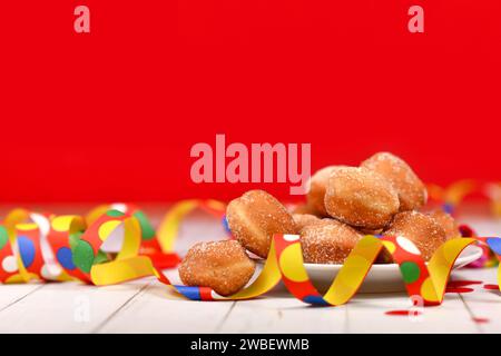 Traditional German 'Berliner Pfannkuchen', a donut without hole filled with jam served during carnival Stock Photo