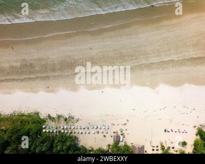 Top down aerial view of a small beach bar and umbrellas on a large, tropical beach (Memories Beach, Khao Lak, Thailand) Stock Photo