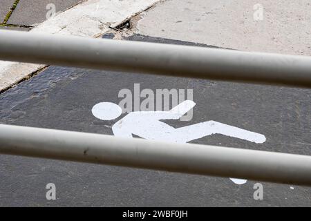 Pedestrian crossing symbol painted on a street Stock Photo