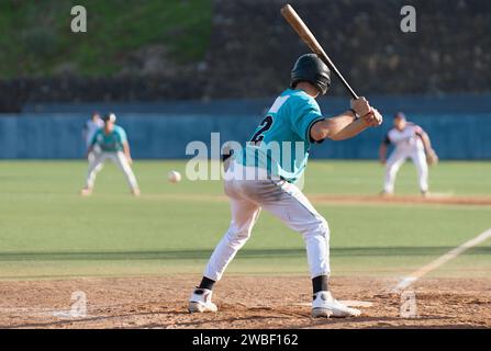 Baseball players in action on the stadium, baseball batter waiting to strike the ball Stock Photo