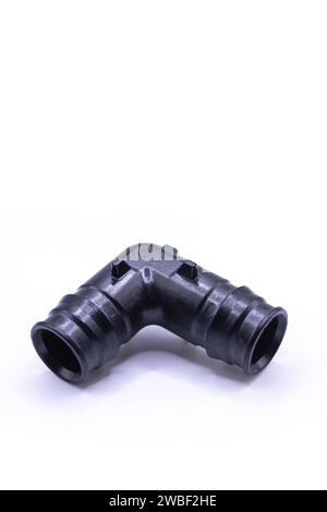 PVC 90 degree elbow plastic pipe fittings, Plumbing equipment for drainage, system plumbing Stock Photo