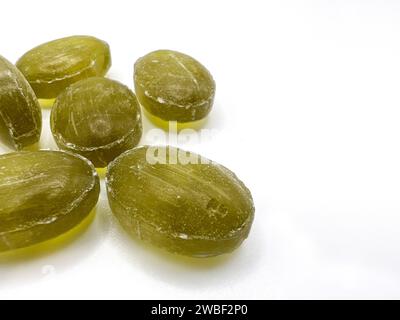 Green mint candies on isolated background with copy space. View of green mint candies on white background with space for text Stock Photo