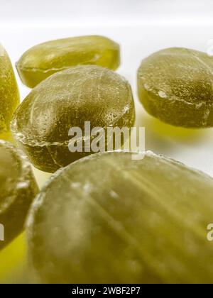 Green mint candies on isolated background with copy space. View of green mint candies on white background with space for text Stock Photo