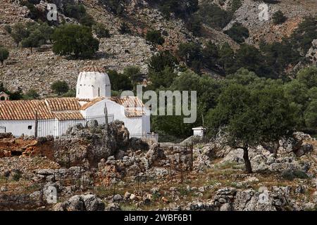 Church of St Michael the Archangel, cross-domed church, A white church stands in the middle of a natural, rocky landscape, Aradena Gorge, Aradena Stock Photo