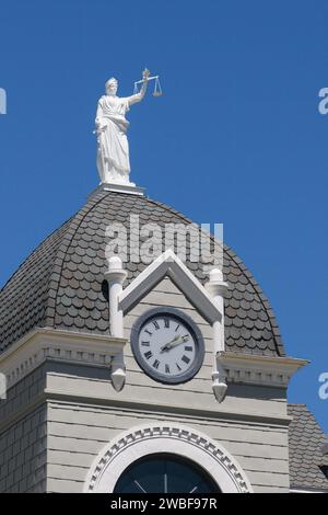 Pomeroy, WA, USA - May 22, 2023; Statue of Lady Justice atop Garfield County Courthouse without a blindfold Stock Photo
