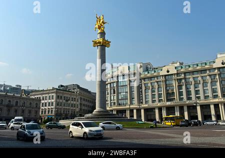 Column with the statue of St George as a dragon fighter on Freedom Square, Tavisuplebis Moedani, Tbilisi, Georgia Stock Photo