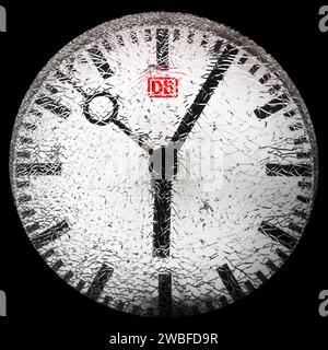 Shattered glass on a railway station clock at night, detail, symbolic photo, Witten, North Rhine-Westphalia, Germany Stock Photo