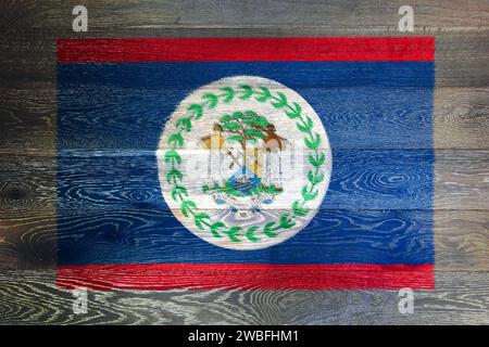 Belize flag on rustic old wood surface background Stock Photo