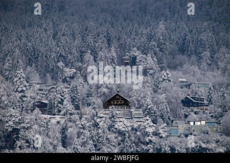 Romantic atmosphere of a house in the Tyrolean Alps in the middle of an enchanted winter landscape Stock Photo