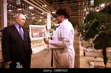 Anadyr, Russia. 10th Jan, 2024. Russian President Vladimir Putin is given a tour of the all-seasons hydroponic greenhouse by entrepreneur Natalya Makatrova at the Makatrov family farm, January 10, 2024 in Anadyr, Chukotka Autonomous Okrug, Russia. The region is the easternmost area of Russia bordering the Bering Strait only 55-miles from Alaska. Credit: Gavriil Grigorov/Kremlin Pool/Alamy Live News Stock Photo