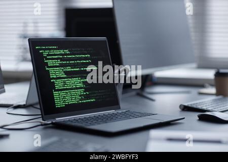 Laptop with Programming Code on Screen Stock Photo