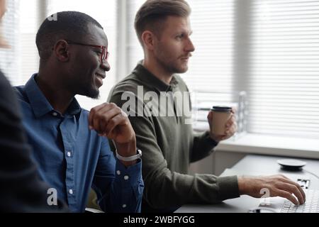 Cybersecurity Specialists Working in Office Stock Photo