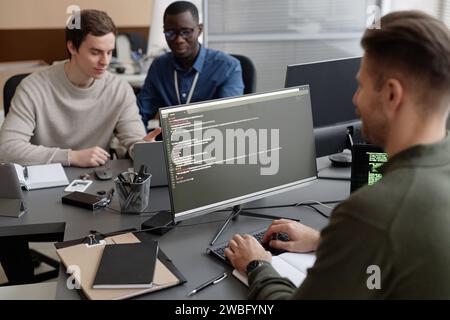 IT Developer Coding on Computer Stock Photo