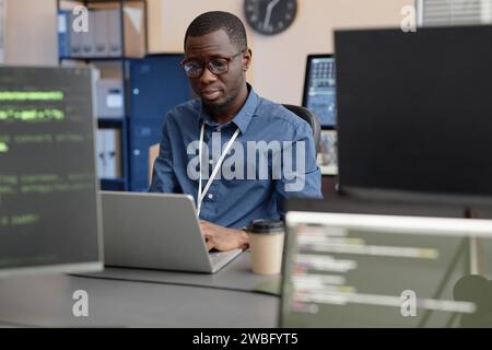 Software Developer Using Laptop in IT Company Office Stock Photo