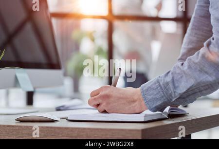 man working making notes in his planner Stock Photo