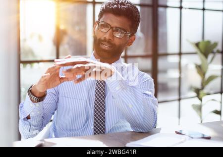 Nervous millennial male freelancer see critical mistake incorrect information in paper document Stock Photo