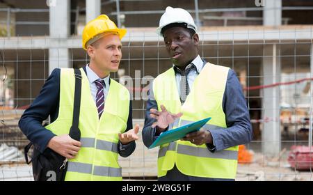 Two architects discussing construction project Stock Photo