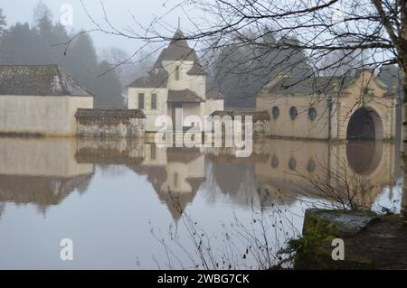 Romanticised in the mist. Mock Dutch Village designed by Paul Waterhouse.  2nd January at  Craigtoun Country Park, St Andrews Stock Photo