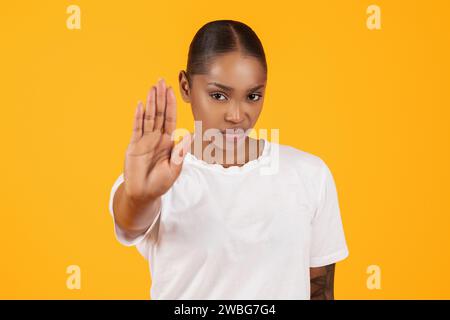 angry african american young woman gesturing stop with hand, studio Stock Photo